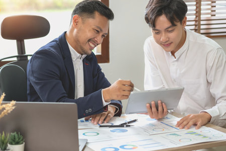 Marketing, Financial, Accounting, Planning, Team of business use calculators and graph analysis to plan marketing strategies and make profitable investments for the company.の写真素材