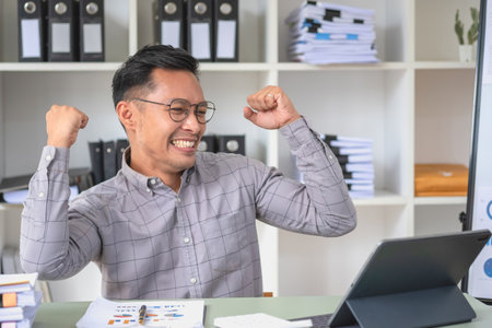 Marketing, Financial, Accounting, Planning, business man expresses his joy at making annual profits for a successful company.の写真素材