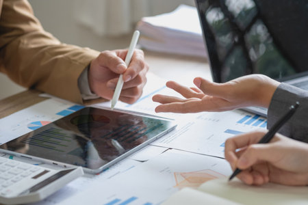 Marketing, Finance, Accounting, Planning, The company is team of marketers analyzes the company is profits using laptop computer graphs and calculators and tablet.Business conceptの写真素材