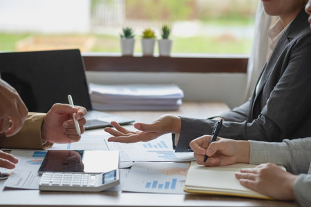 Marketing, Finance, Accounting, Planning, The company is team of marketers analyzes the company is profits using laptop computer graphs and calculators and tablet.Business conceptの写真素材