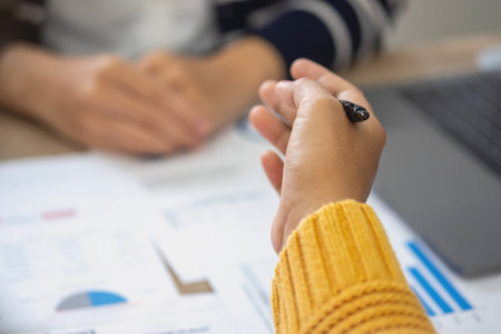 Marketing, Finance, Accounting, Planning, Team female accountant using laptop calculator and documents, charts, graphs in the analysis of the company is profit.の写真素材