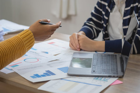 Marketing, Finance, Accounting, Planning, Team female accountant using laptop calculator and documents, charts, graphs in the analysis of the company is profit.の写真素材