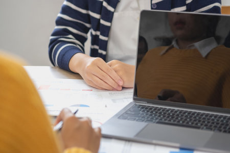 Marketing, Finance, Accounting, Planning, Team female accountant using laptop calculator and documents, charts, graphs in the analysis of the company is profit.の写真素材