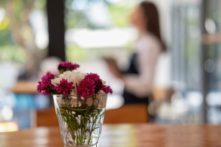 Portrait of a woman, a coffee shop business owner smiling beautifully and opening a coffee shop that is her own business, Small business concept.の写真素材