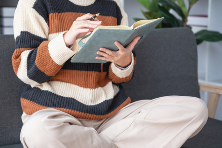 Asian girl students study online, stay at home, teacher, video call, and zoom online. Happy Asian girl learning English online with laptop computer, tablet and mobile phone. online learning concept.の写真素材