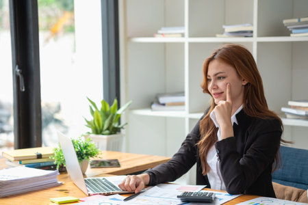 Business, finance and employment, female successful entrepreneurs concept. Confident smiling Asian businesswoman, using a laptop at workの写真素材