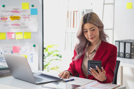 planning, auditing, business planning, finance, young asian business woman working on computer and checking investment documents and planning marketing to increase profit, business conceptsの写真素材