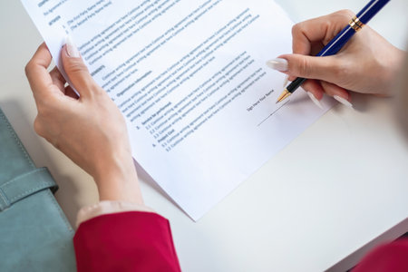 Asian female lawyer or legal advisor signing a contract The contract documents that work on your...