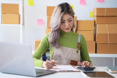 Starting a small business SME business owners, entrepreneurs, unboxing work check order online To prepare to pack into boxes for sale to customers, SME business ideas online.の写真素材