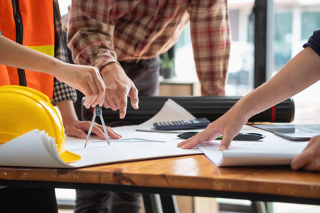 Concept meeting engineers or architects for projects working with partners and engineering tools to create models and blueprints at the job site. construction concept. Engineer concept.の写真素材