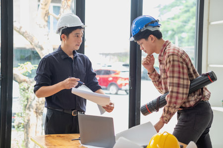 Concept meeting engineers or architects for projects working with partners and engineering tools to create models and blueprints at the job site. construction concept. Engineer concept.の写真素材
