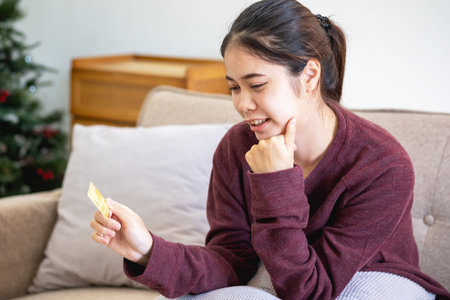 Beautiful Asian women using credit cards for shopping online with laptops and smartphones, online shopping portrait concept.の写真素材