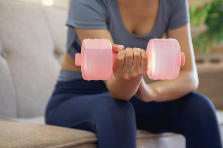 Women are stretching, at home, and fitness Women exercise or do yoga in their bedroom for health and wellness a healthy, calm female person training or working on the house floor.の写真素材