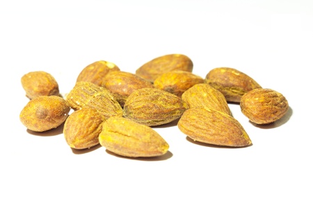 Roast almonds, isolated on white の写真素材