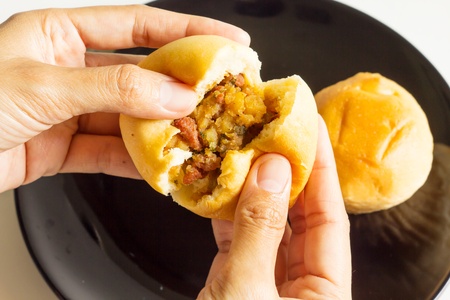Eating bread stuffing の写真素材