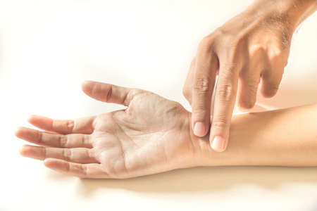 Touching to fell pulse の写真素材