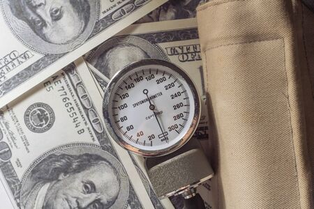 Sphygmomanometer on money の写真素材