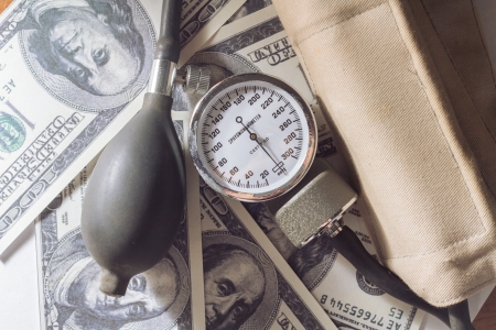 Sphygmomanometer and money の写真素材