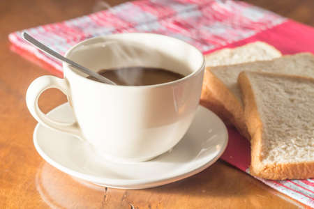 Black coffee and whole wheat breads の写真素材