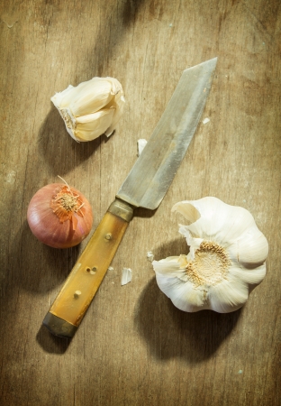 Garlic and shallot with knife の写真素材