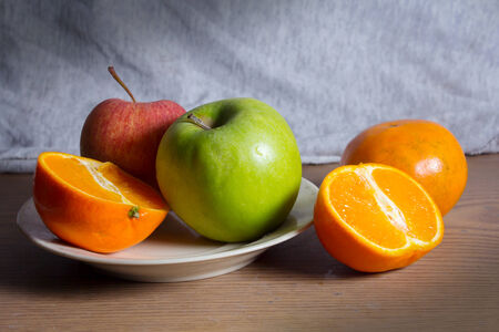 Still life combination fruits,green and red apple with orange の写真素材