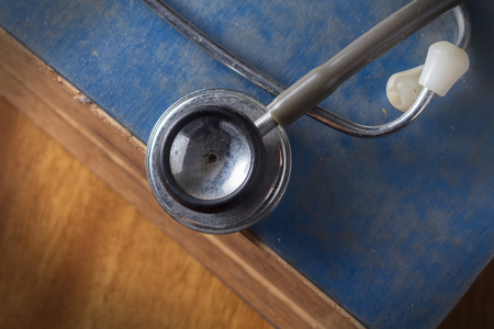 Stethoscope on antique book の写真素材