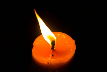 Candle light in black background の写真素材