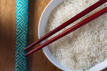 Raw rice in bowl,top view の写真素材