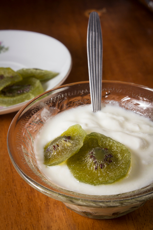 Yogurt with dried kiwi,still life.の写真素材