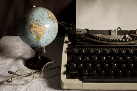 Still life globe and eyeglasses with typewriter,vintage color.の写真素材