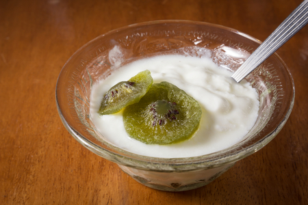 Yogurt with dried kiwi,still life.の写真素材