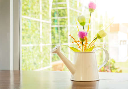 Flowers in metal vase,vintage filtered color.の写真素材