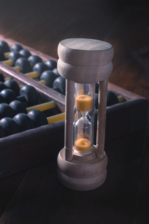 Still life Abacus and hourglass,old tools.の写真素材