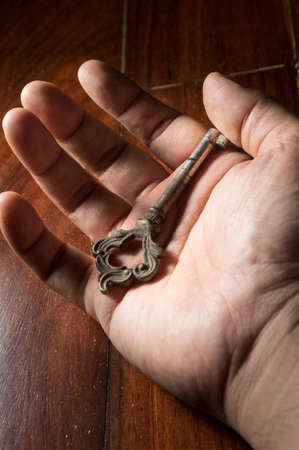 Old key in hand,still life.
