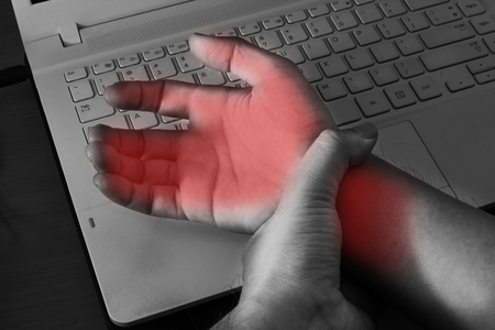 Carpal tunnel syndrome,wrist pain from working with computer.の写真素材