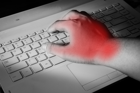 Carpal tunnel syndrome,wrist pain from working with computer.の写真素材