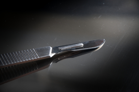 Surgery knife on metal plate,medical tools.の写真素材