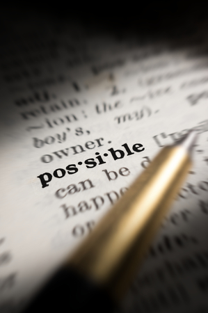 Closeup Possible word in book with pen.の写真素材