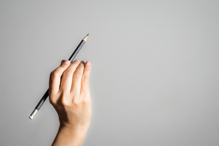 Woman hand writing with pencil.の写真素材
