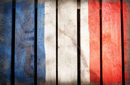Vintage grunge filtered,France national flag on wood background.の写真素材