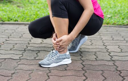 Sport girl suffered with ankle injury.