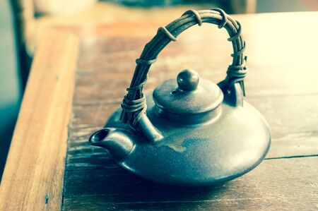 Ceramic tea pot on table,vintage filtered.の写真素材