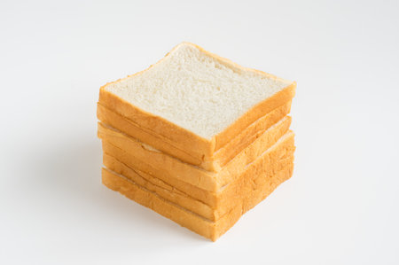Stack of white soft breads on white background.の写真素材