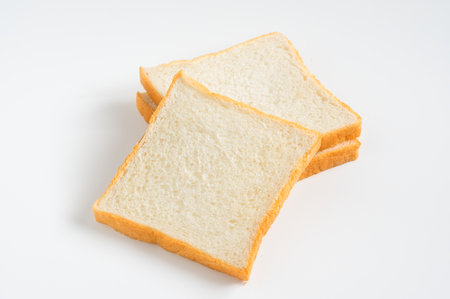 Sliced white soft breads on white background.の写真素材