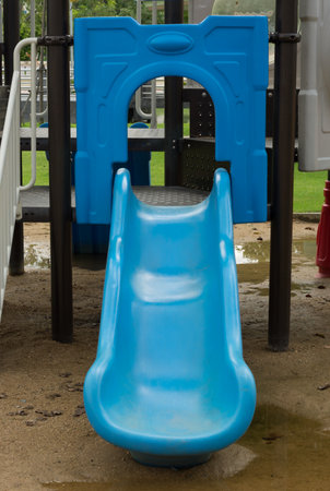 Blue slider tunnel in playground.の写真素材