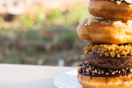 Stack donuts on wooden backgroundの写真素材