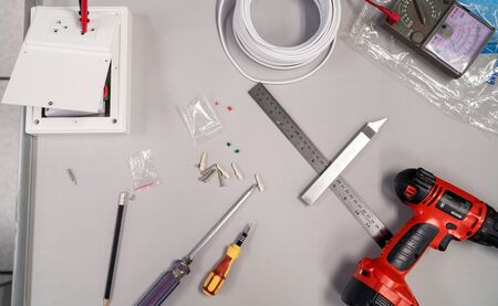 Top view work tools and electrical equipment on a deskの写真素材