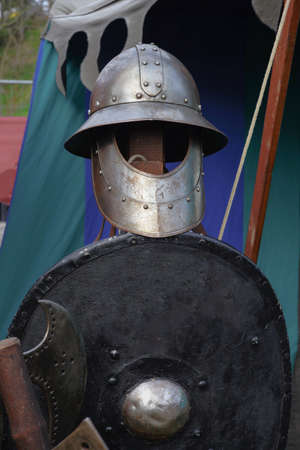 Arming of a medieval warrior. Seen of a medieval knight festival.の写真素材