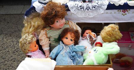 Arranged flea market dolls in a group child toyの写真素材