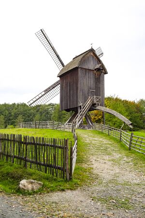 Ancient wooden windmill in Germanyの写真素材